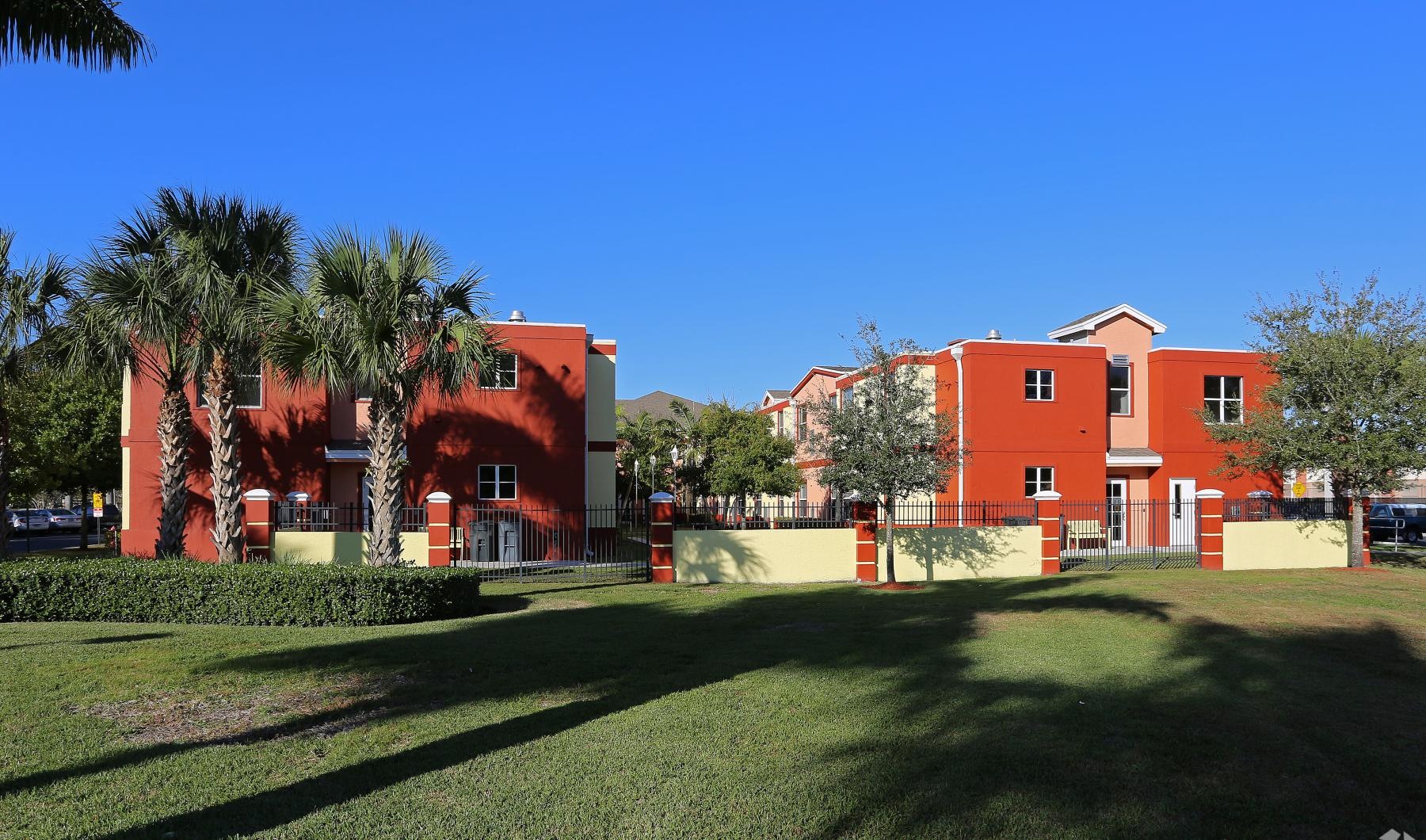 a large building with trees in front of it