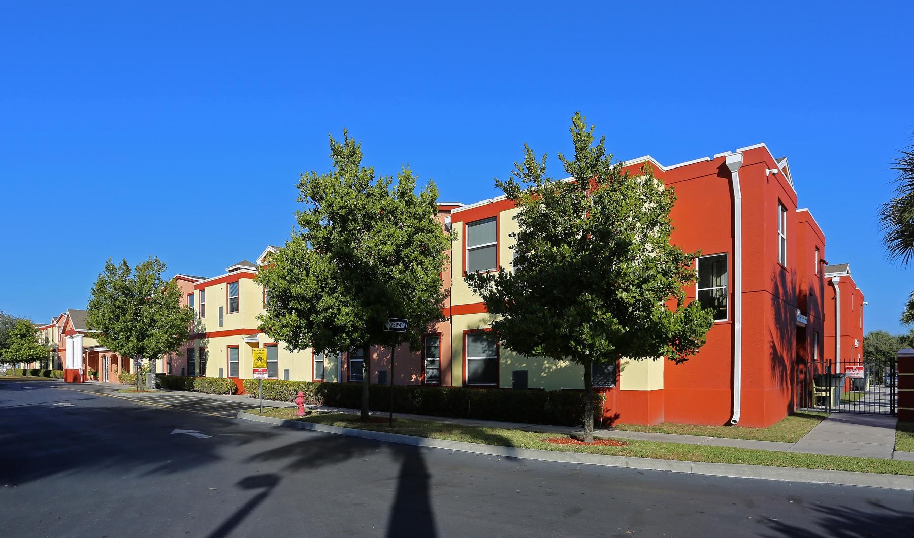 a street with trees and buildings along it